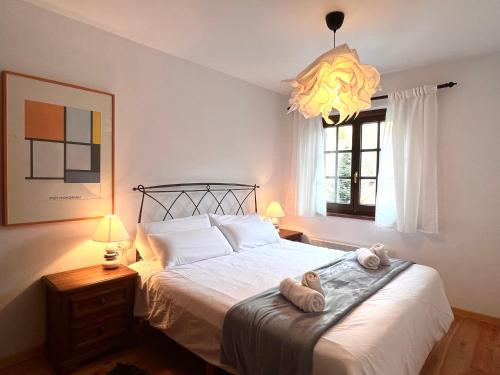 Ένα ή περισσότερα κρεβάτια σε δωμάτιο στο Apartament de La Coma - L'Amfitriona