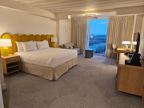 a hotel room with a bed and a large window at B Resort and Spa Located in Disney Springs Resort Area in Orlando