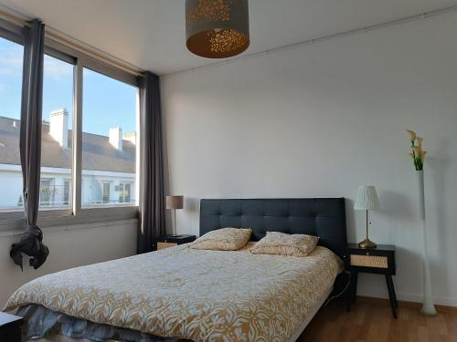 Ένα ή περισσότερα κρεβάτια σε δωμάτιο στο Appartement cathédrale