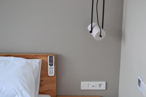 Кровать или кровати в номере Village apartments Polyana