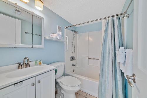a bathroom with a toilet and a sink and a shower at Gulf Shores Surf & Racquet Club 401A in Gulf Shores