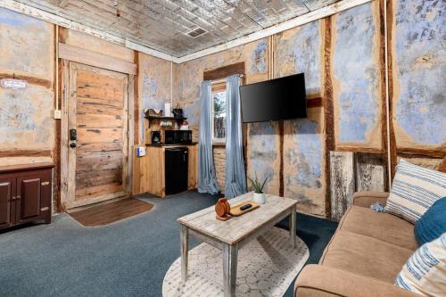 a living room with a couch and a table at #7 The Hideaway in New Braunfels