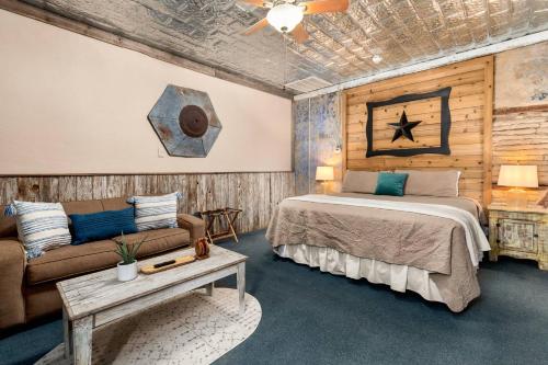 a bedroom with a bed and a couch at #7 The Hideaway in New Braunfels