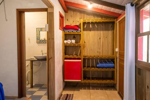 a bathroom with a shower and a sink at Pousada Cacau in Praia do Rosa