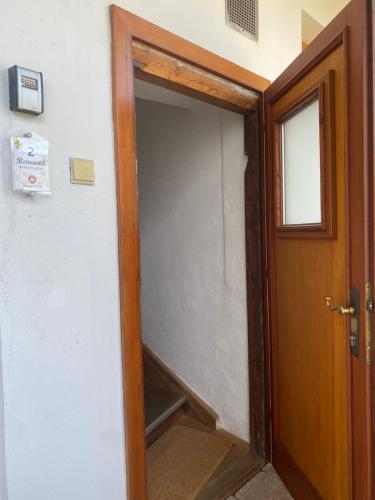 an open door to a room with a closet at Weingut Martinshof in Sankt Ulrich