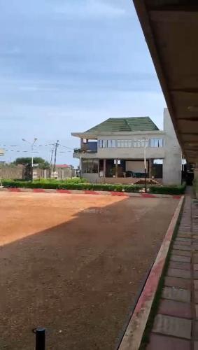 a large building with a road in front of it at CISFOP in Abomey-Calavi