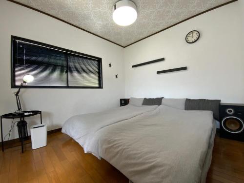 Ένα ή περισσότερα κρεβάτια σε δωμάτιο στο 一棟貸し平戸俺んち