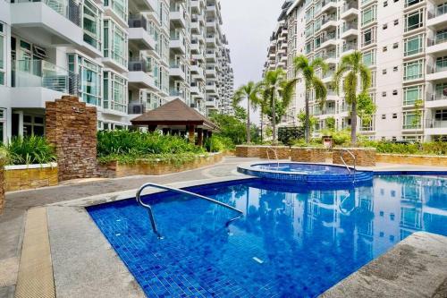 a swimming pool in the middle of a building at NAIA T3 -10 PERCENT OFF JUNE GRADUATION PROMO- Fully Interiored 1 BR Unit in Manila