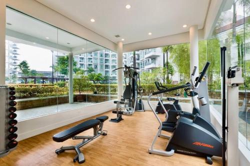 a gym with treadmills and ellipticals in a building at NAIA T3 -10 PERCENT OFF JUNE GRADUATION PROMO- Fully Interiored 1 BR Unit in Manila
