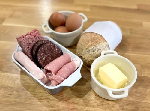 a lunch box with meat cheese and bread and eggs at Hazells Lodge Farm Stay Sleeps 2 Hottub Pool Table at Ayrshire Rural Retreats in Galston