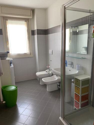 a bathroom with a toilet and a sink at la Casa di Luca in Sarnico