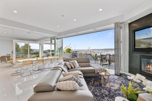 a living room with a couch and a fireplace at Piermont Waterfront Villa with Hot Tub in Piermont