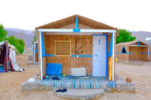 a small shack in the middle of a desert at Magic land taba camp in Taba