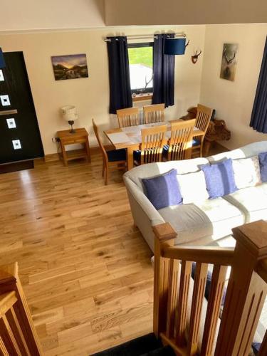 a living room with a couch and a table at Scottish Highland house Fort William in Corran