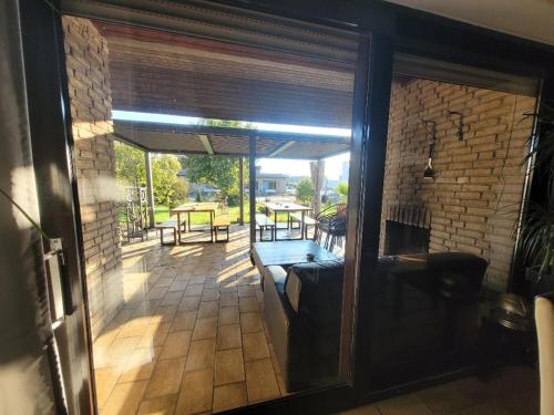 a view of a patio through a glass door at Hani's Partyhaus in Verl