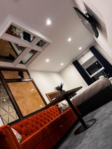 a living room with a couch and a table at 53 Luxury Rooms in Maynooth
