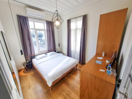 Ένα ή περισσότερα κρεβάτια σε δωμάτιο στο Serguzest Otel
