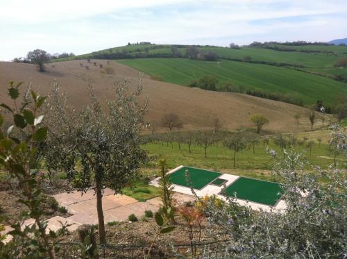 a view of the farm from the hill at Relais Il Margarito in Montefano