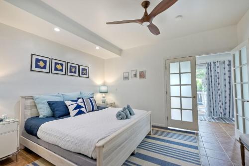 a bedroom with a bed and a ceiling fan at La Costa Escape - Pool, BBQ, Gated Parking in Encinitas
