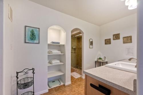 a white bathroom with a sink and a shower at La Costa Escape - Pool, BBQ, Gated Parking in Encinitas