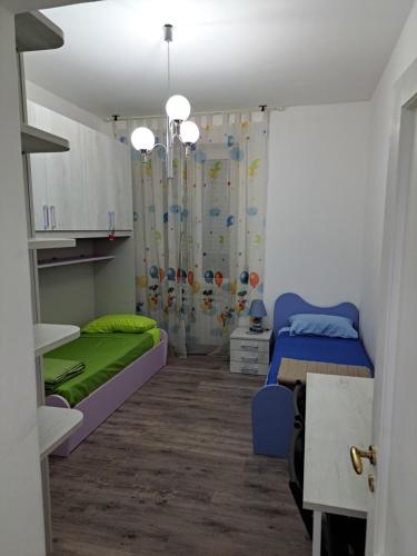 a room with two beds and a curtain at Welcome home in Terni