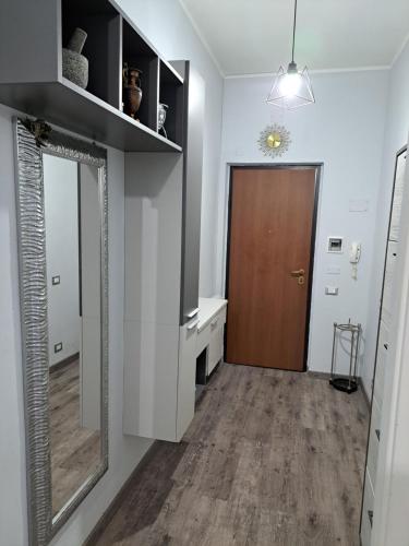 a room with a hallway with a door and a mirror at Welcome home in Terni