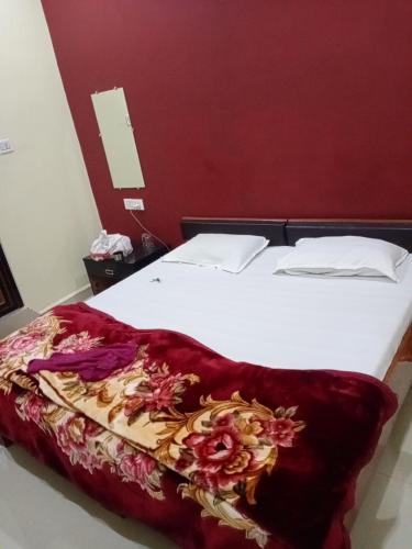 Krevet ili kreveti u jedinici u objektu Gajanan hotel