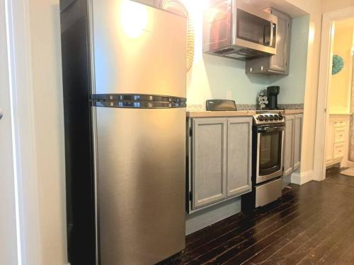 a kitchen with a stainless steel refrigerator at Piano Room Studio with full kitchen and no fees in Florence