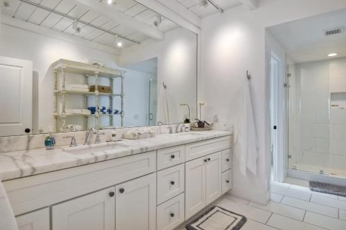 a white bathroom with two sinks and a shower at Juniper Beach Entire Home - Sleeps 18 - Oceanfront in Carlsbad