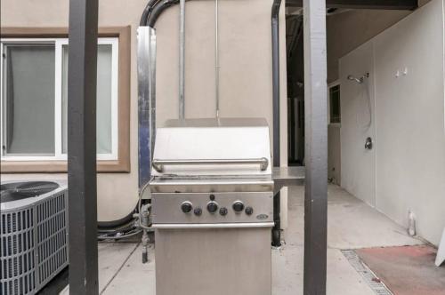 a kitchen with a stove in a room at Private room shared full bathroom Torrey pines golf UCSD in San Diego