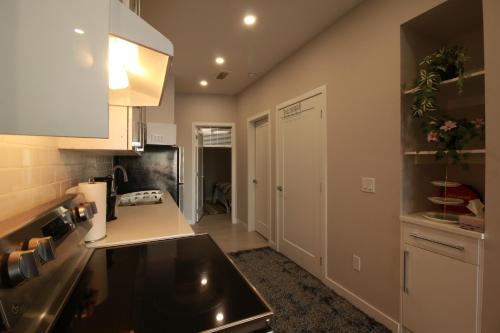 a kitchen with a sink and a counter top at Feel at home in Chestermere in Chestermere