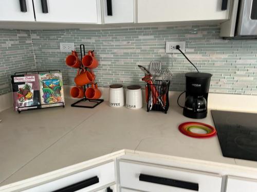 a kitchen counter top with utensils on it at Casa Centrica 