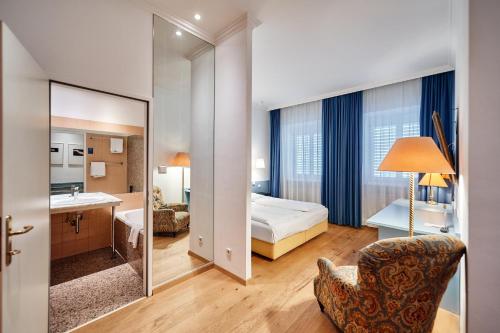 Postel nebo postele na pokoji v ubytování Hotel Kunsthof