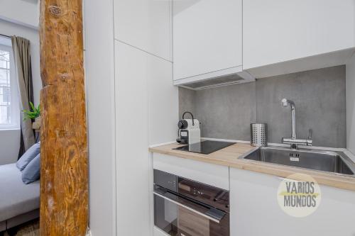 a kitchen with a sink and a counter top at Cool And New Apt 3px entre Gran Via y Palacio Real in Madrid