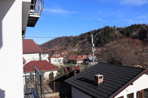 a view of a roof of a town with houses at White House Moieciu in Moieciu de Jos