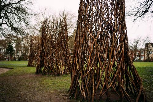 a group of trees standing in a park at Tor zur Altstadt in Husum