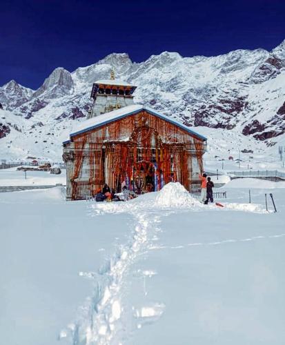 a building is under construction in the snow at haridwar jmg and kedarnath Hotel in Haridwār