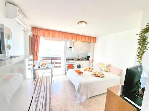 a living room with a bed and a kitchen at Elegant Studio with Sea View in Benalmádena - 30 m² in Benalmádena