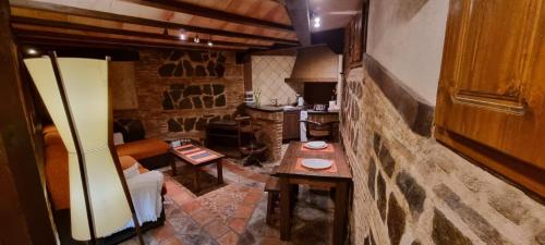 a room with tables and a bar in a building at Cueva árabe en el casco antiguo, Toledo in Toledo