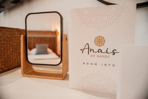 a sign for an aritzia of mens room info at Anais Of Naxos in Agia Anna Naxos