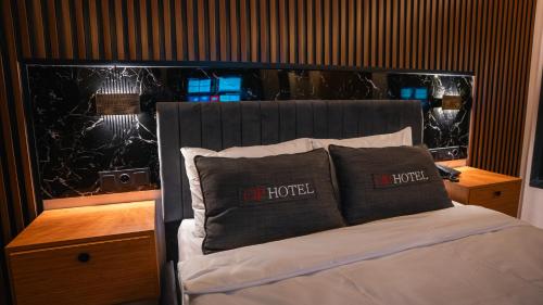 a bedroom with a bed with two pillows on it at Cip Hotel & Spa - İstanbul Bakırköy City Center in Istanbul