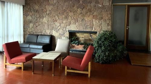 Χώρος καθιστικού στο Hotel Rossetti y Spa