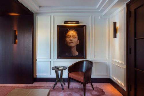 a room with a portrait of a woman on the wall at The Ritz-Carlton New York, Central Park in New York