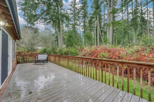 a wooden deck with a bench on it at Dogwood Place in Johnson Landing