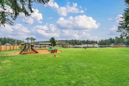 a park with a playground with a swing at Dogwood Place in Johnson Landing
