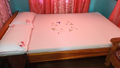 Postel nebo postele na pokoji v ubytování Green Magpie Homestay