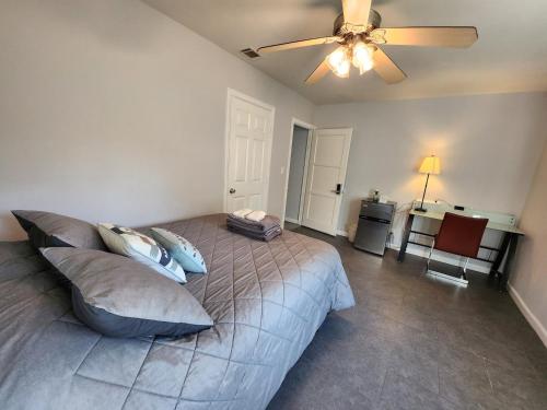 a bedroom with a bed and a ceiling fan at Private Room2 Own Entry Shared Bath One Guest Walk to UCSD in San Diego