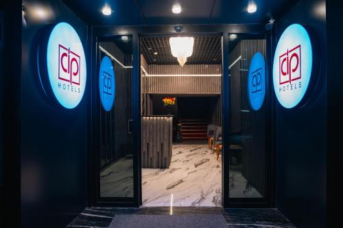 a doorway to a room with two signs on the wall at Cip Hotel & Spa - İstanbul Bakırköy City Center in Istanbul