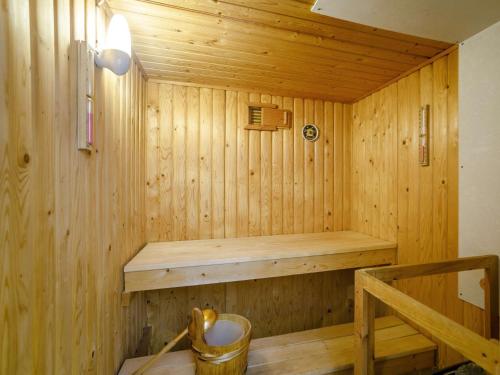 a wooden sauna with a bench in a room at 3 bed in Rothbury 63025 in Rothbury