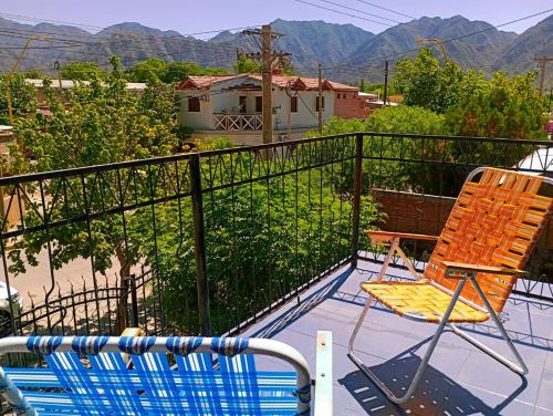 a patio with a chair and a swimming pool at M y M Departamento in Belén